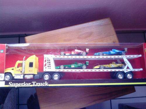 BRAND NEW FRICTION OPERATED TRUCK AND TRAILER SET WITH FOUR FORMULA CARS ON TRAILER